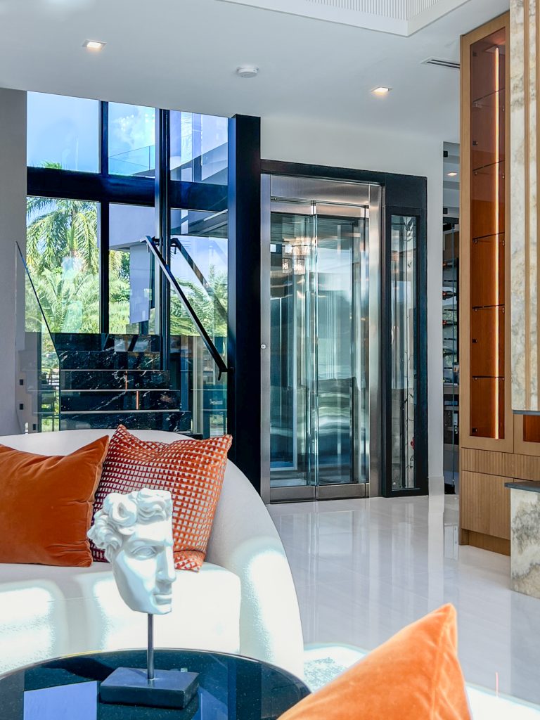 Glass Commercial-Style Doors and glass wall home elevator design